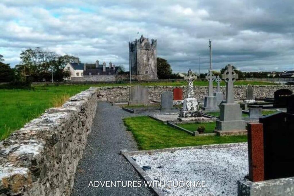 Image of a graveyard in Ireland with Claregalway Castle in the background
