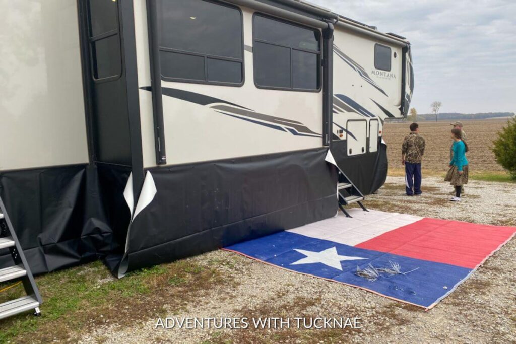 Showing mid-process of putting our RV skirting on our rig. The skirting is up but not sealed. 