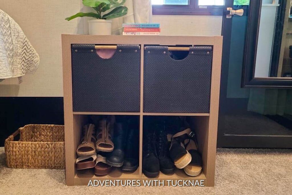 Four cubby organizer in a Keystone Raptor 423 showing shoe storage in the bottom two cubbies