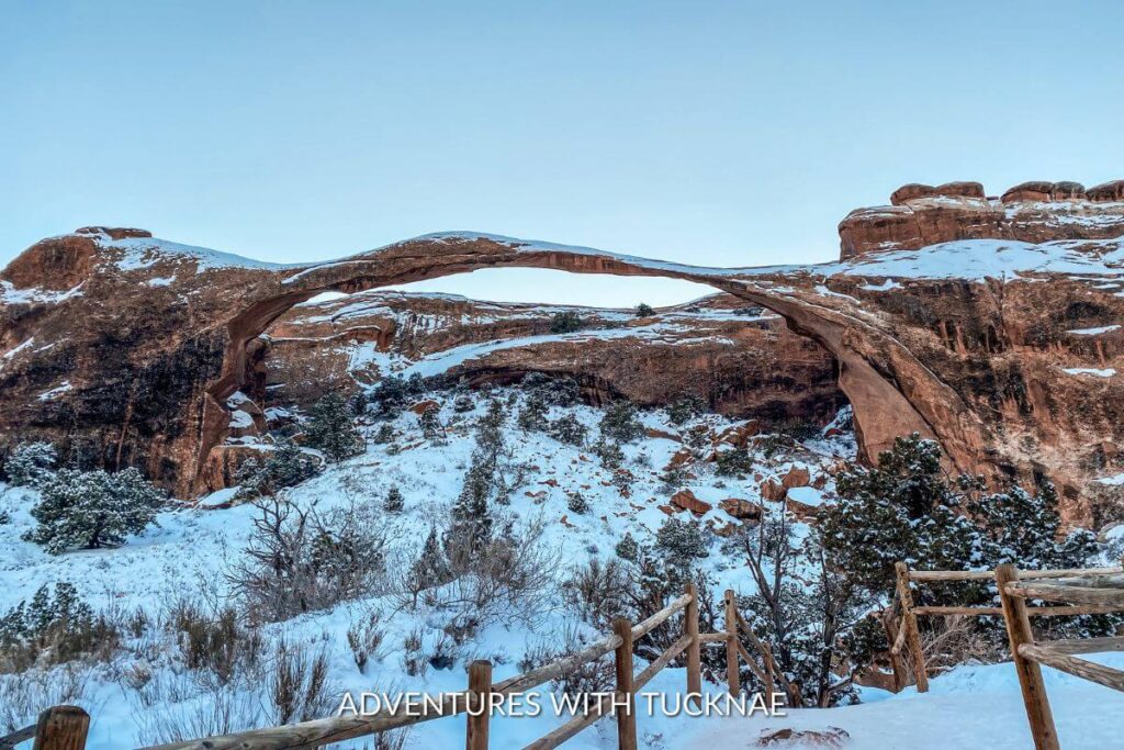 A snowy view of Landscape Arch in Arches National Park.