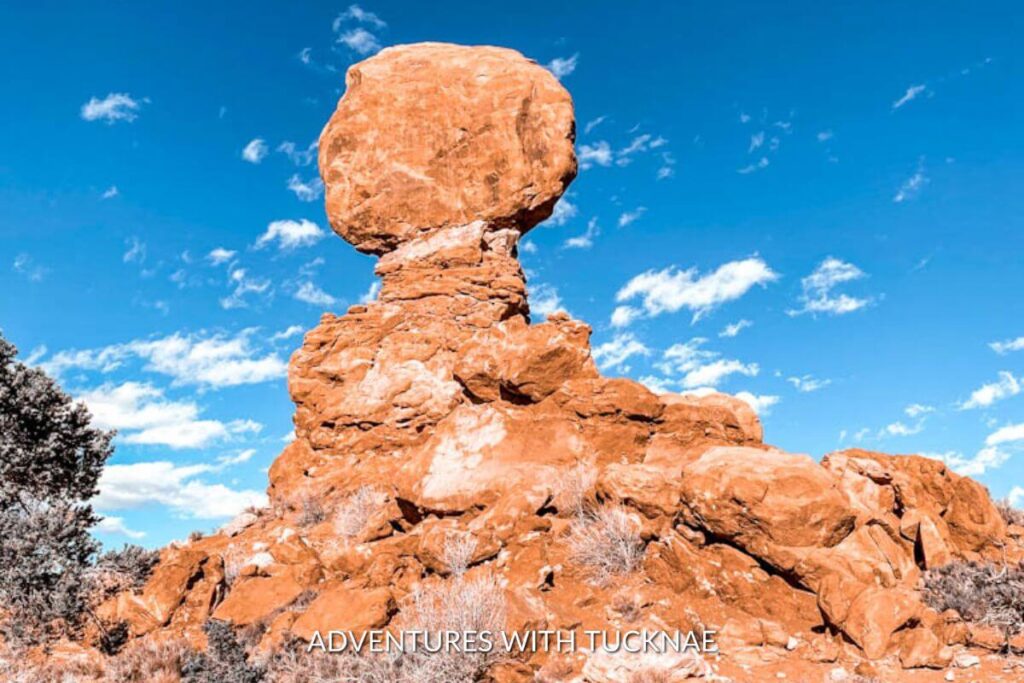 The Balanced Rock landmark in Arches National Park. There is one large boulder on top of other rocks that gives it the illusion of balancing. 