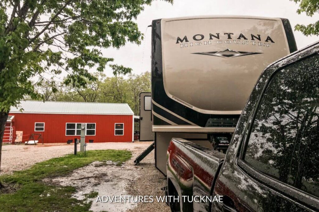 A Montana High Country RV and truck parked in a Passport America campground.
