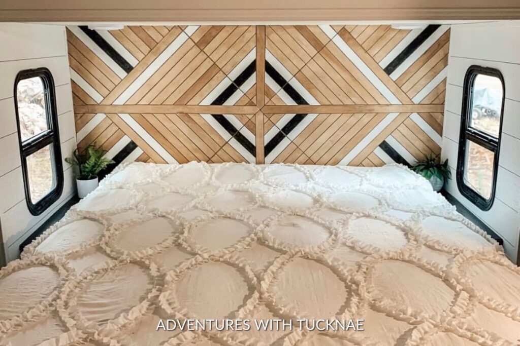 A unique RV headboard with a pattern made out of wood