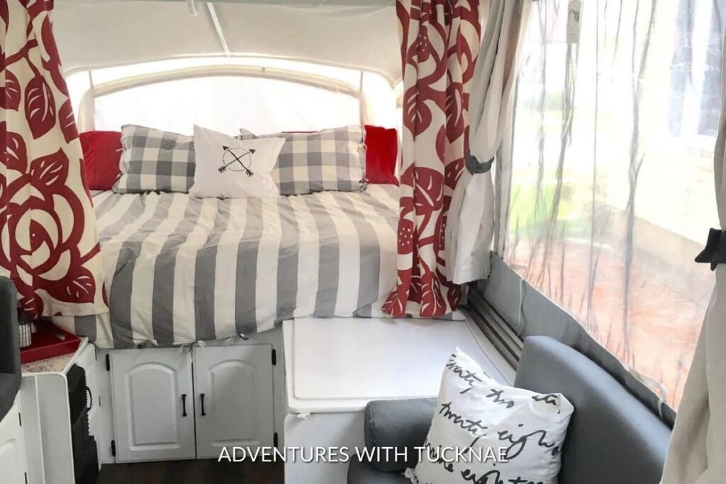 A tiny popup trailer bedroom renovation with red and grey colors