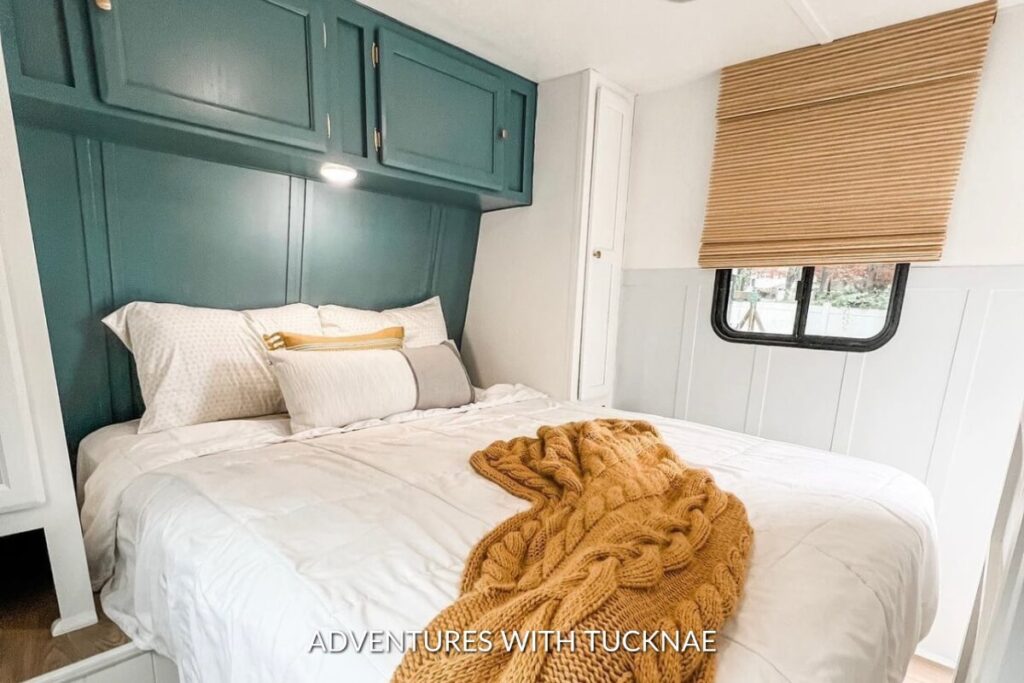 A modern and simple RV bedroom renovation with teal blue and mustard yellow accents
