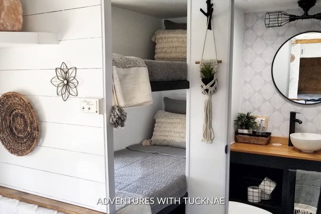 A darling grey, white, and black RV bunk room renovation