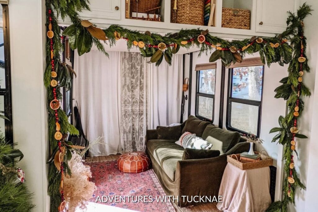 Orange and cranberry garland hung in an RV for Christmas