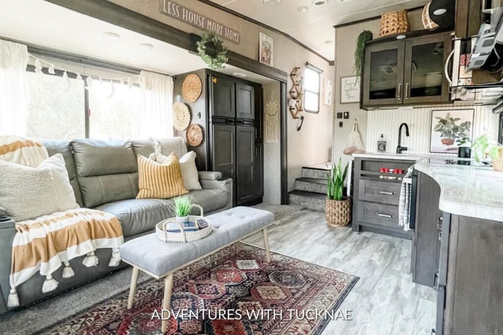 A simple RV renovation decorated with plants, decor, and a rug