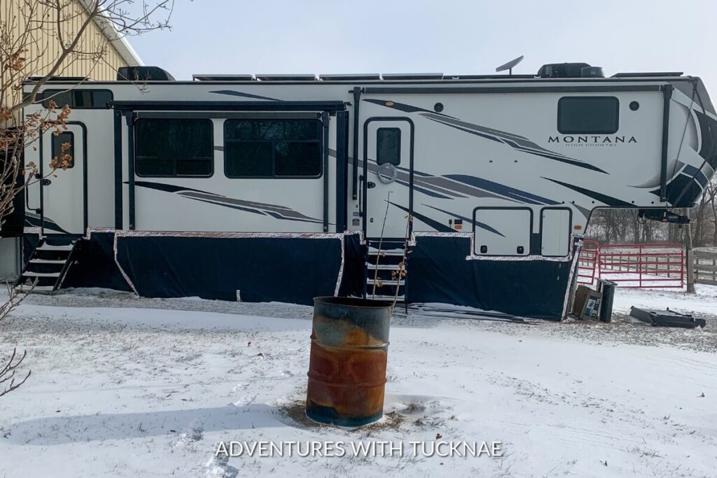 A Montana High Country fifth wheel in the cold of winter with snow on the ground