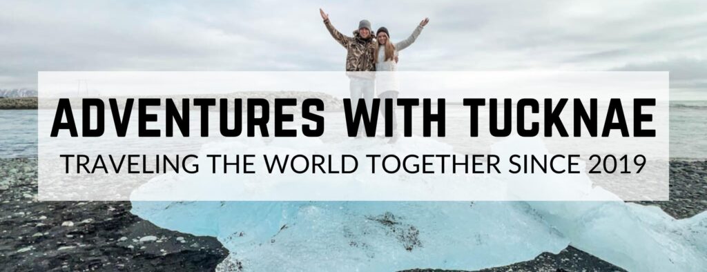 A picture of a couple in Iceland with text overlay reading "Adventures With TuckNae - Traveling the World Together Since 2019"