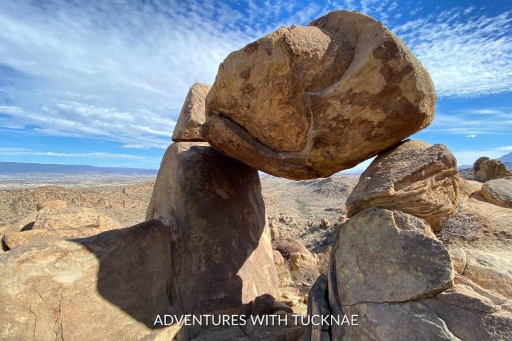 The iconic Balanced Rock poised atop two boulders against a clear sky, seen on the Grapevine Hills Trail, part of bucket list national park hikes in Big Bend National Park.
