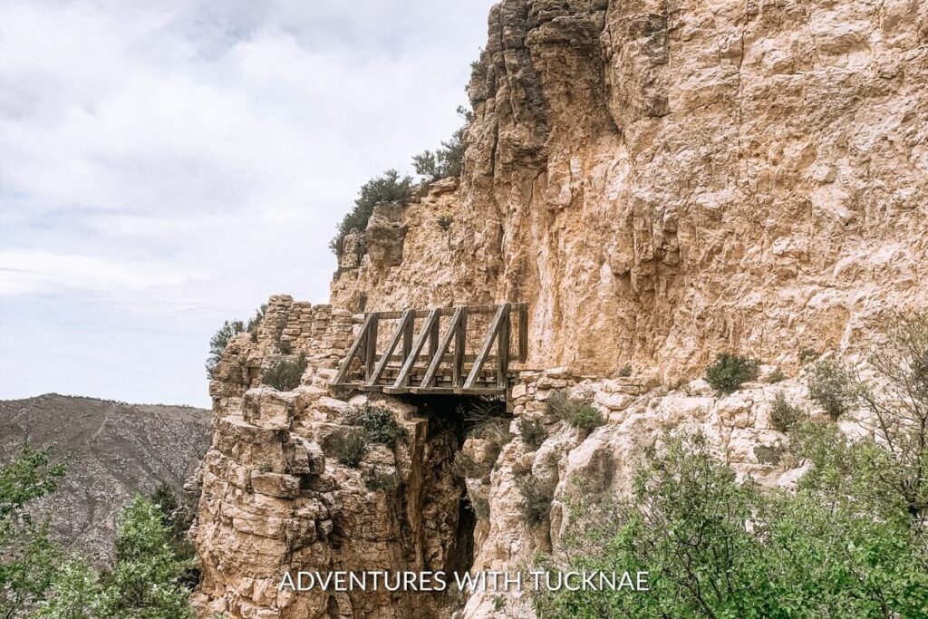 A wooden bridge on the Guadalupe Peak Texas Highpoint Trail, offering adventurous hikers spectacular views as part of their bucket list national park hikes in Guadalupe Mountains National Park.