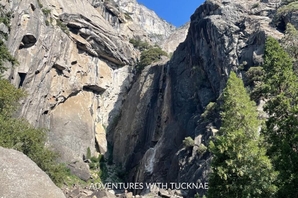 The powerful Lower Yosemite Falls seen from the trail, a premier destination for bucket list national park hikes in Yosemite National Park.