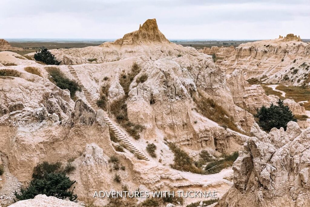 Steep canyons and striking geological formations along the Notch Trail, a dramatic and adventurous bucket list national park hike in Badlands National Park.