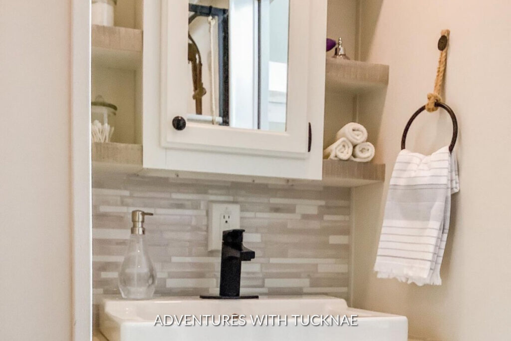 A cute RV bathroom remodel with a new vanity, sink, and accessories