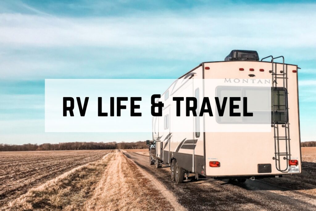 A Montana RV driving through the country with blue skies and open fields