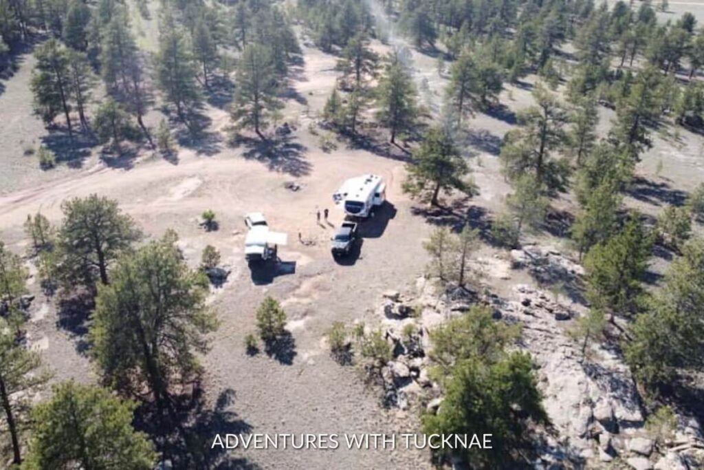 A group of RVers boondocking in a national forest