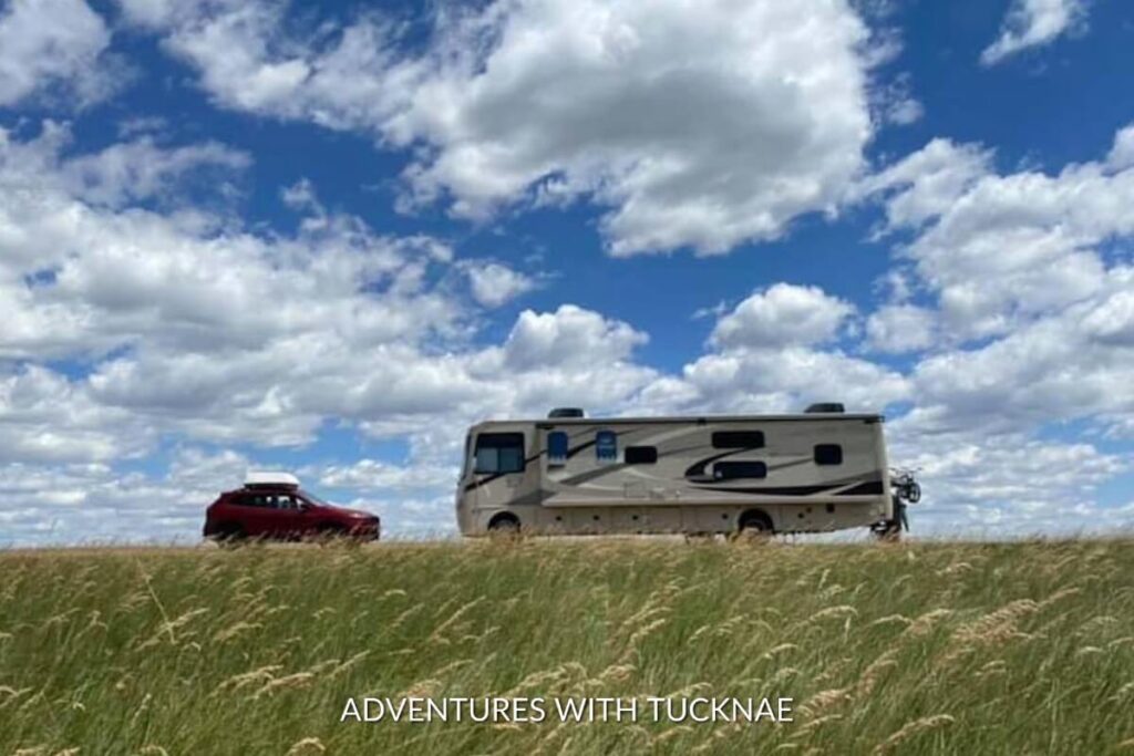 A large RV boondocking in the grasslands