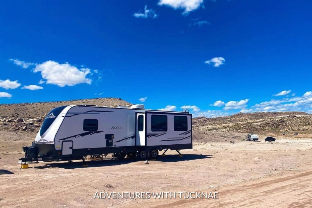 A travel trailer boondocking in the desert