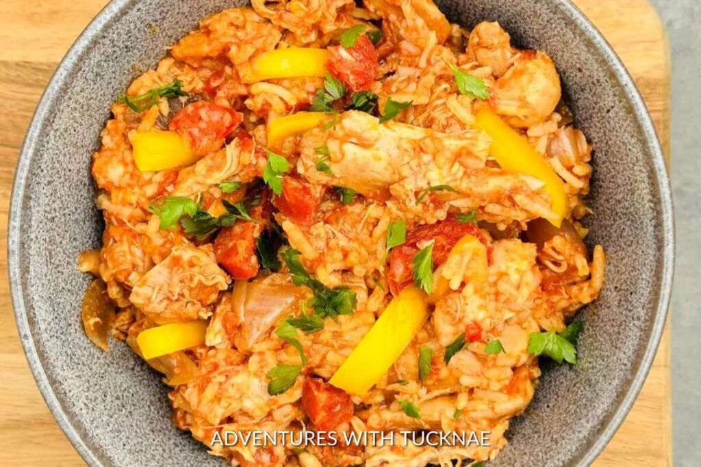 Hearty slow cooker chicken and chorizo paella, a colorful and flavorful meal for an adventurous RV camping trip.