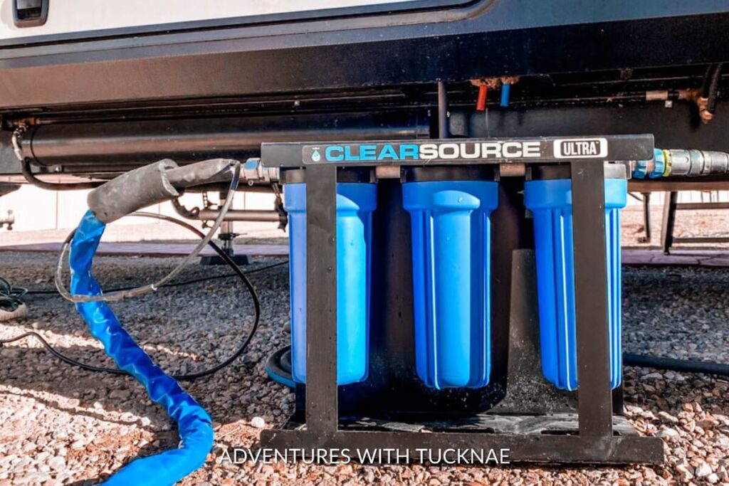 A Clearsource Ultra RV water filter system installed under an RV, showcasing a practical and essential gift for RV owners to ensure clean water supply.