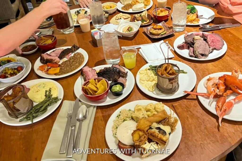 An abundant spread of various dishes including meats, seafood, and sides on a long table, showcasing the variety and abundance of a Las Vegas buffet.