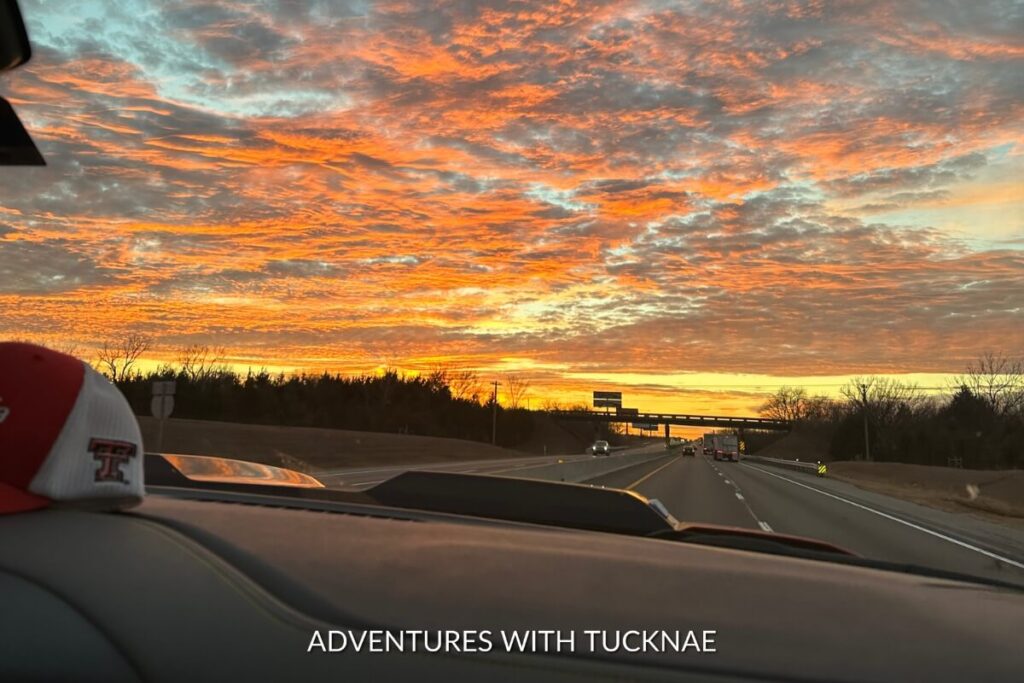 A colorful sunset sky during a road trip
