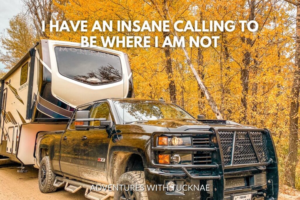 A pickup truck towing an RV parked amidst Fall trees with the quote 'I have an insane calling to be where I am not.'