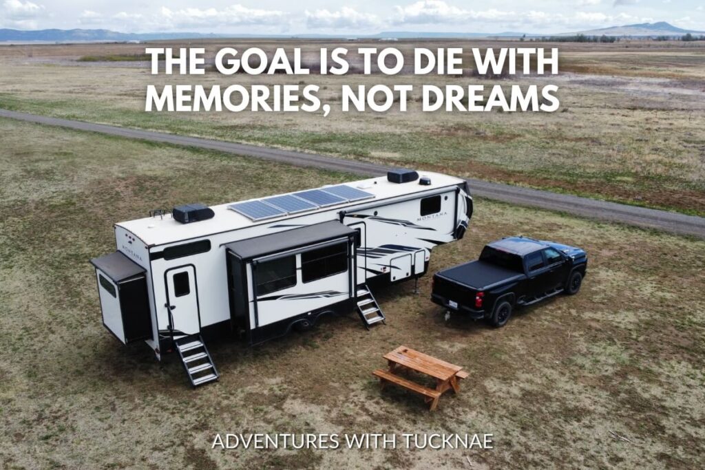 A truck towing an RV in an open field with the quote 'The goal is to die with memories, not dreams.'