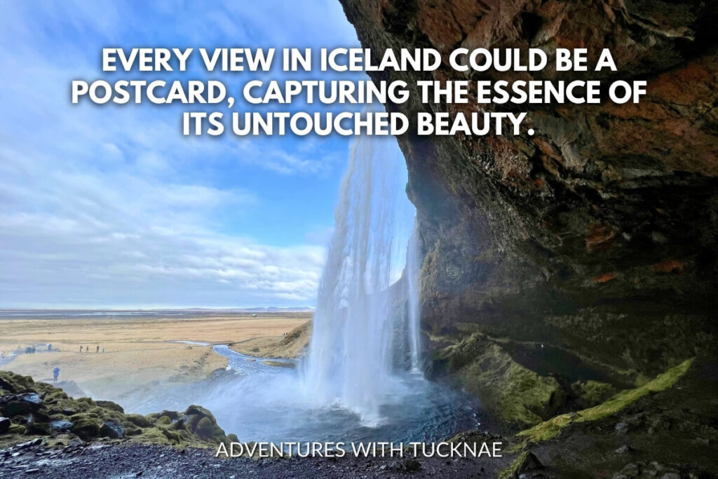 A majestic waterfall cascades over a cave in Iceland with the quote, "Every view in Iceland could be a postcard, capturing the essence of its untouched beauty."