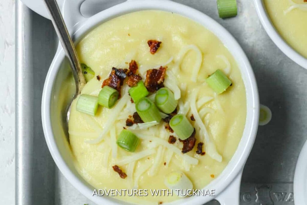 Instant Pot Potato Soup: Creamy and comforting Instant Pot potato soup in a bowl, topped with cheese, bacon, and green onions, a warm treat on a chilly camp night.