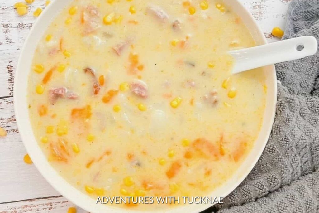 Instant Pot Ham & Potato Soup: A bowl of hearty Instant Pot ham and potato soup, rich and filling with a creamy base, perfect for refueling after a day of outdoor activities.