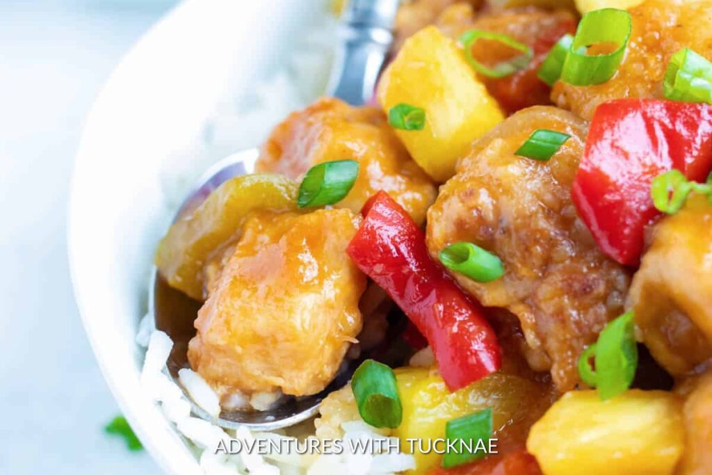 Sweet and tangy Instant Pot Hawaiian Chicken with pineapple chunks and bell peppers, making a colorful camping meal that's sure to please.
