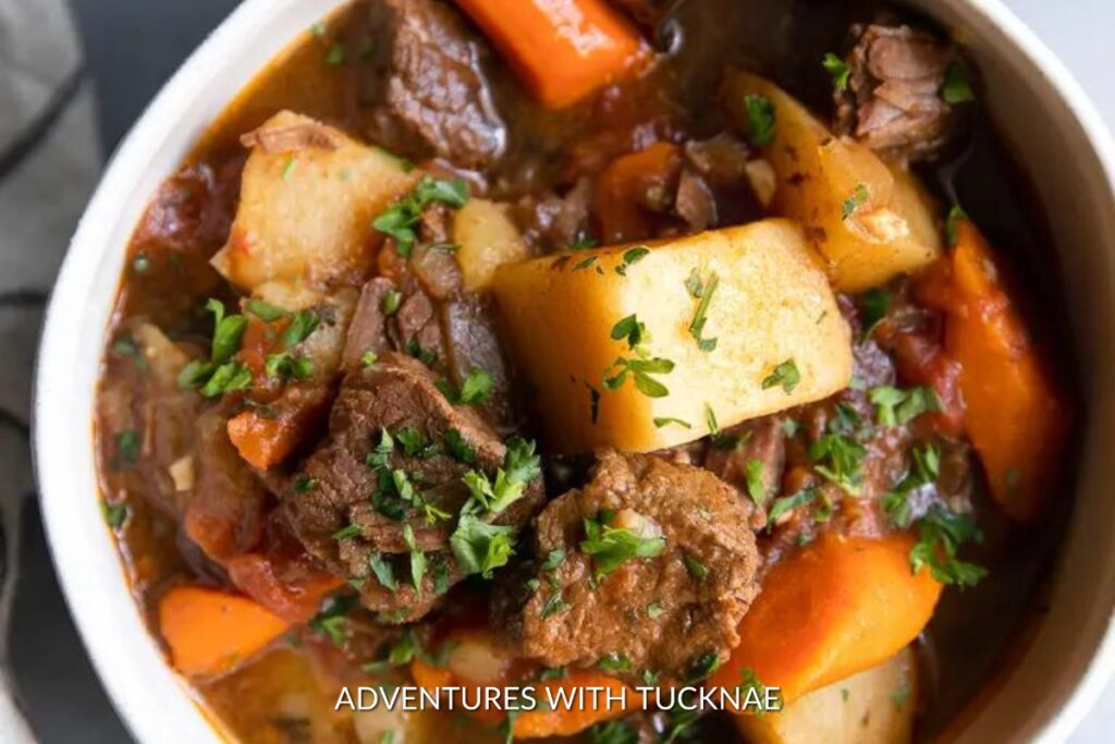 Instant Pot Beef Stew: A bowl full of rich and savory Instant Pot beef stew, with chunks of beef, potatoes, carrots, and herbs, a perfect camping meal.