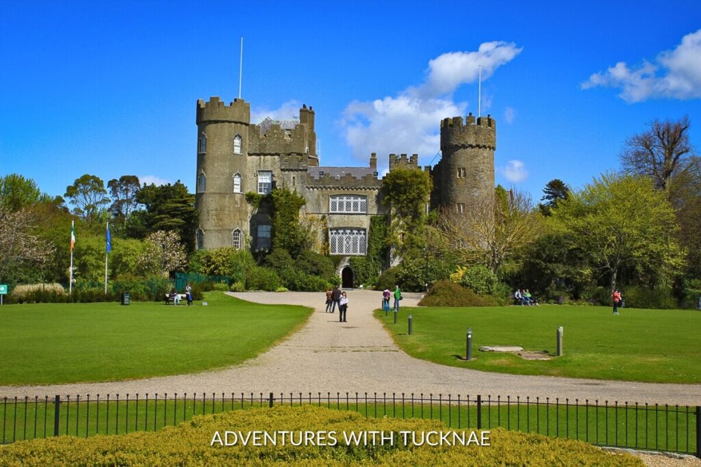 Malahide Castle stands amidst sprawling lawns and gardens, a classic Irish heritage site and a sought-after Instagram spot in Ireland.