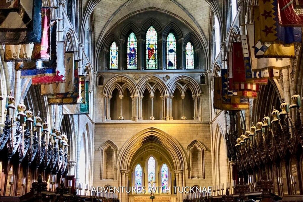 The grand interior of St. Patrick's Cathedral, with its soaring arches and flags, captures the essence of an Instagrammable historic site in Ireland.