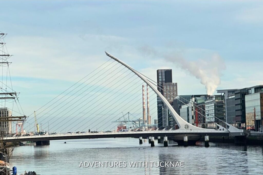 The Samuel Beckett Bridge spanning the River Liffey, a modern marvel and Instagrammable sight in Dublin, with its harp-like structure against a cityscape backdrop.