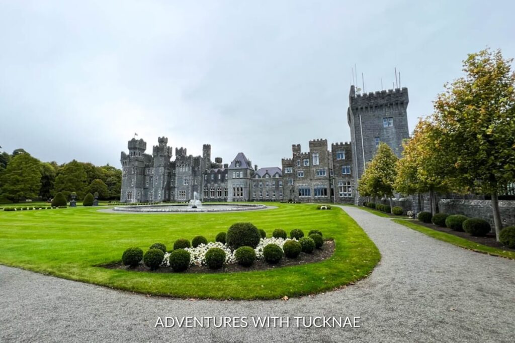 Ashford Castle's magnificent facade reflects an era of splendor, surrounded by manicured gardens, making it an iconic Instagram spot in Ireland.