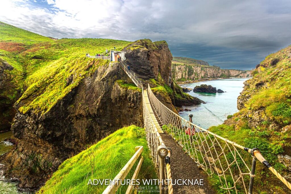 The rugged Carrick-a-Rede Rope Bridge at Ballintoy stretches across the cliffside, offering an adventurous experience for weekend breaks in Ireland.