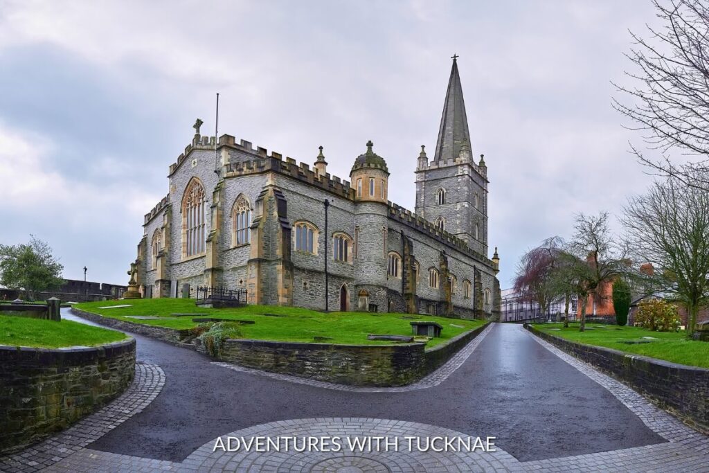 The ancient architecture of St. Columb's Cathedral in Derry stands majestically, reflecting the city's rich history for visitors on a weekend break in Ireland.