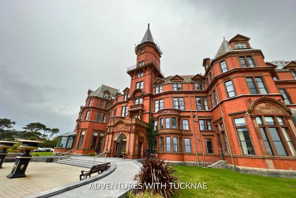 The grandeur of Slieve Donard with the hotel's striking red brickwork, offering Instagrammable Victorian architecture.