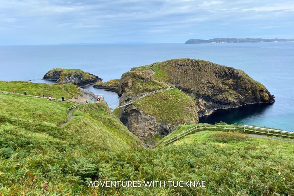 Carrick-a-rede Bridge, a rope bridge connecting to a small island against a backdrop of dramatic cliffs and emerald waters, offers an Instagrammable thrill for adventurers in Northern Ireland.