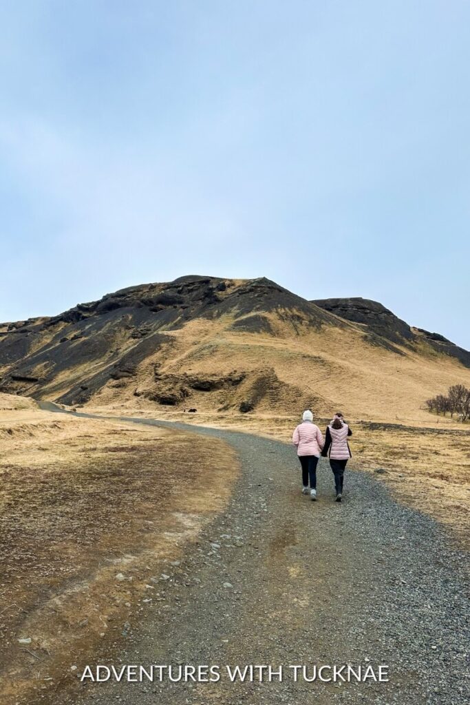Two girls walking along the trail to Kvernufoss 