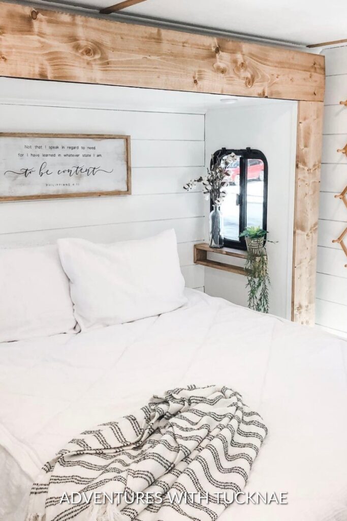 A bright white and wood RV bedroom makeover
