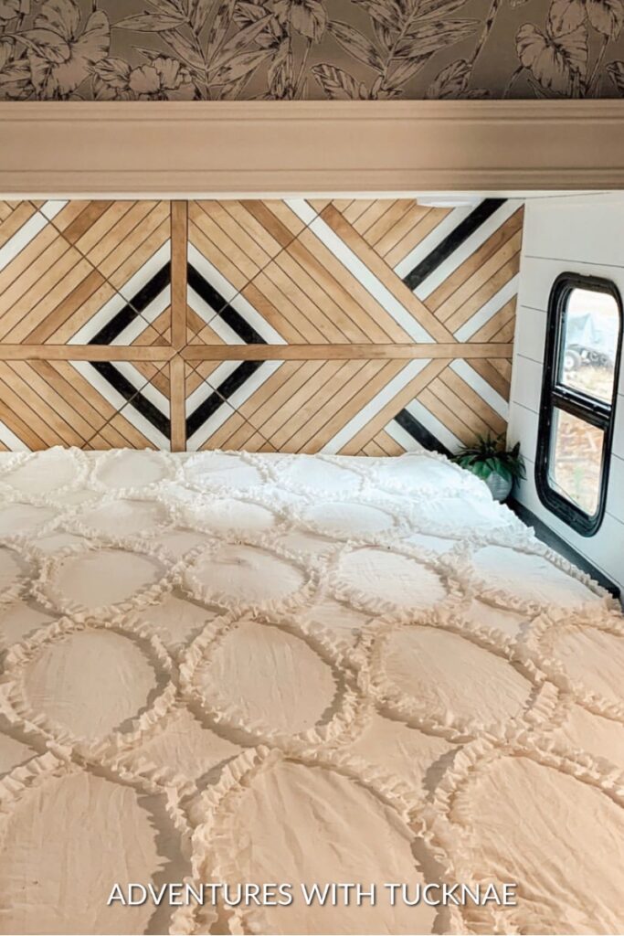 A unique RV headboard with a pattern made out of wood