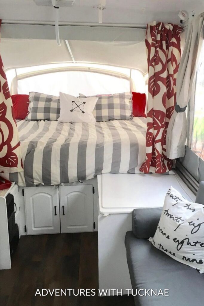 A tiny popup trailer bedroom renovation with red and grey colors